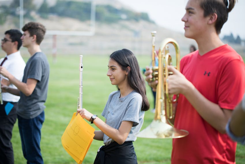  Marching band practice with two female students. 
