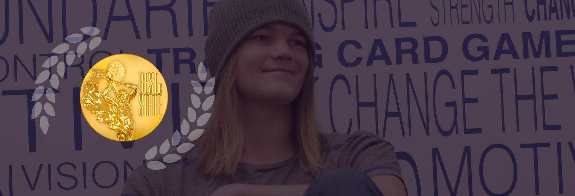 NUAMES student next to Best of State logo